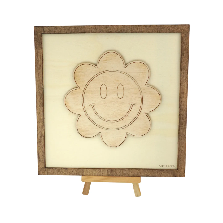 Customizable wall art frame of a flower smiley in cut and engraved wood front view with easel Woodillusion