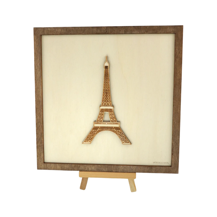 Customizable wall art frame of the Eiffel Tower in cut and engraved wood front view with easel Woodillusion
