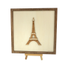 Customizable wall art frame of the Eiffel Tower in cut and engraved wood front view with easel Woodillusion