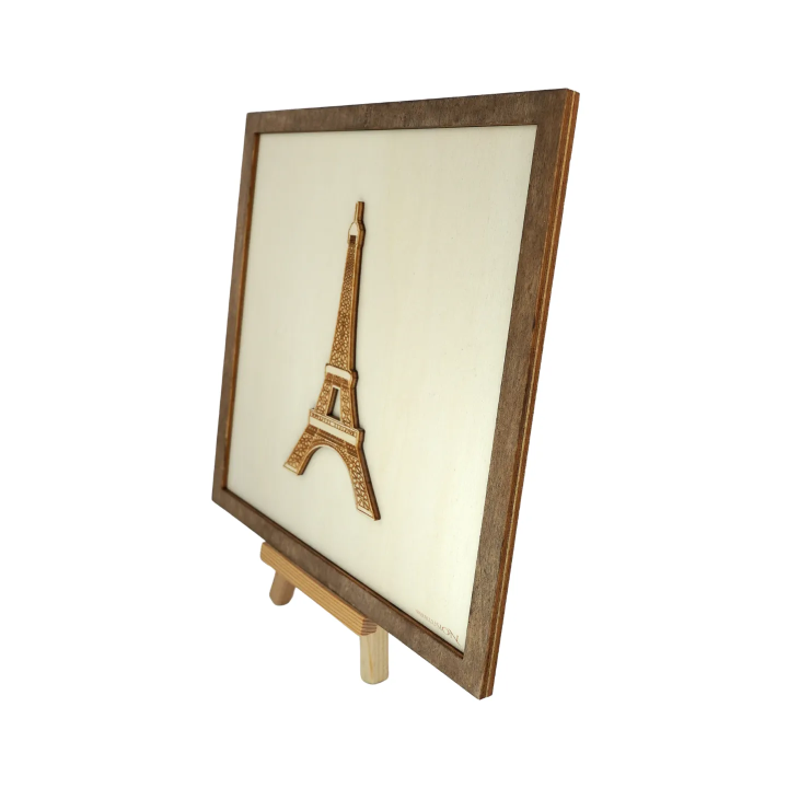 Customizable wall art frame of the Eiffel Tower in cut and engraved wood side view with easel Woodillusion