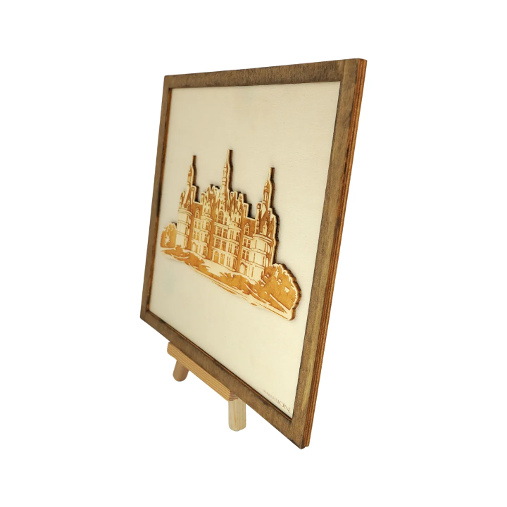 Customizable wall art frame of the Château de Chambord in cut and engraved wood side view with easel Woodillusion