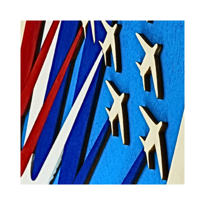 Zoom on a customizable wall art frame of aerial aerobatics in cut and engraved wood