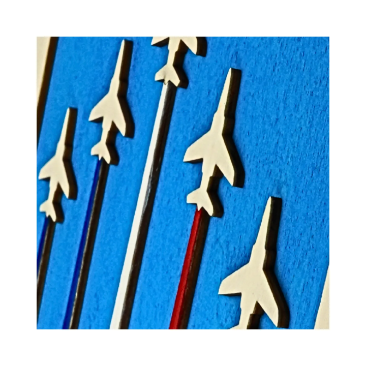 Zoom on a customizable wall art frame of aerial aerobatics in cut and engraved wood