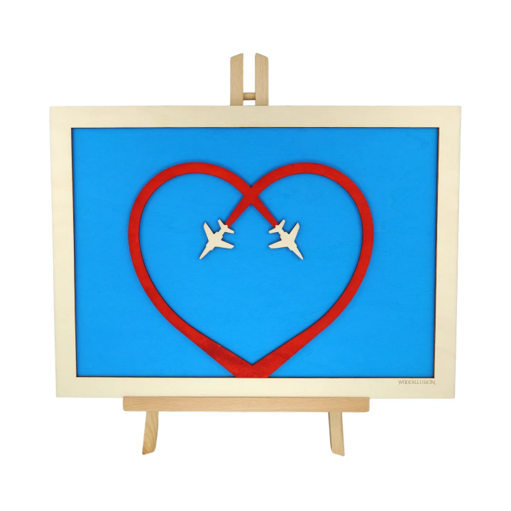 Customizable wall art frame of aerial aerobatics in cut and engraved wood front view with easel Woodillusion