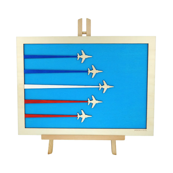 Customizable wall art frame of aerial aerobatics in cut and engraved wood front view with easel Woodillusion
