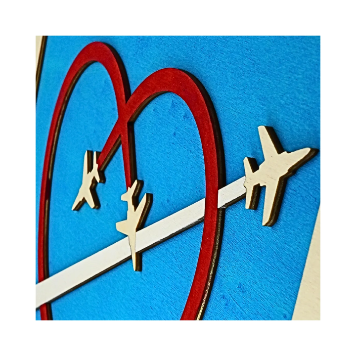 Zoom on a customizable wall art frame of aerial aerobatics in cut and engraved wood side view with easel Woodillusion