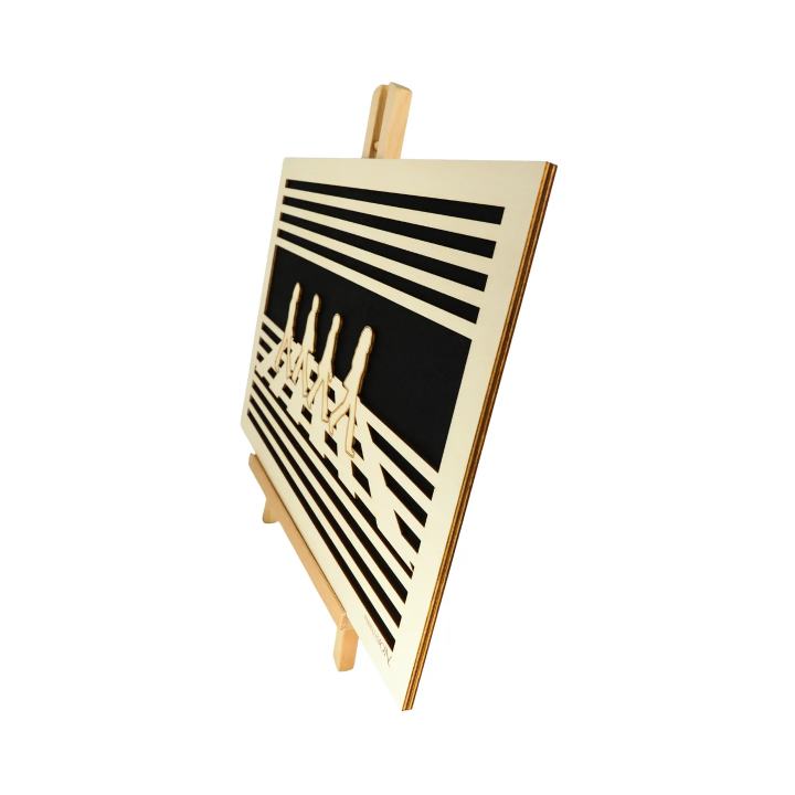 Waiting room view with a customizable wall art frame of The Beatles Abbey Road design in cut and engraved wood