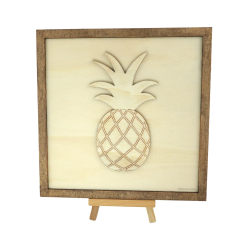 Customizable wall art frame of a pineapple in cut and engraved wood front view with easel Woodillusion
