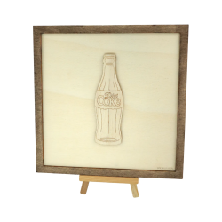 Customizable wall art frame of a Coke bottle in cut and engraved wood front view with easel Woodillusion